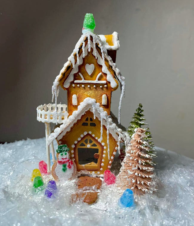 Two story gingerbread house made of cardboard