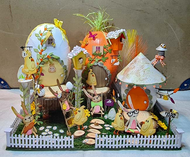 Detailed Easter houses in Easter Village - 3 egg-shaped houses. Paper chicks and bunnies decorate the front