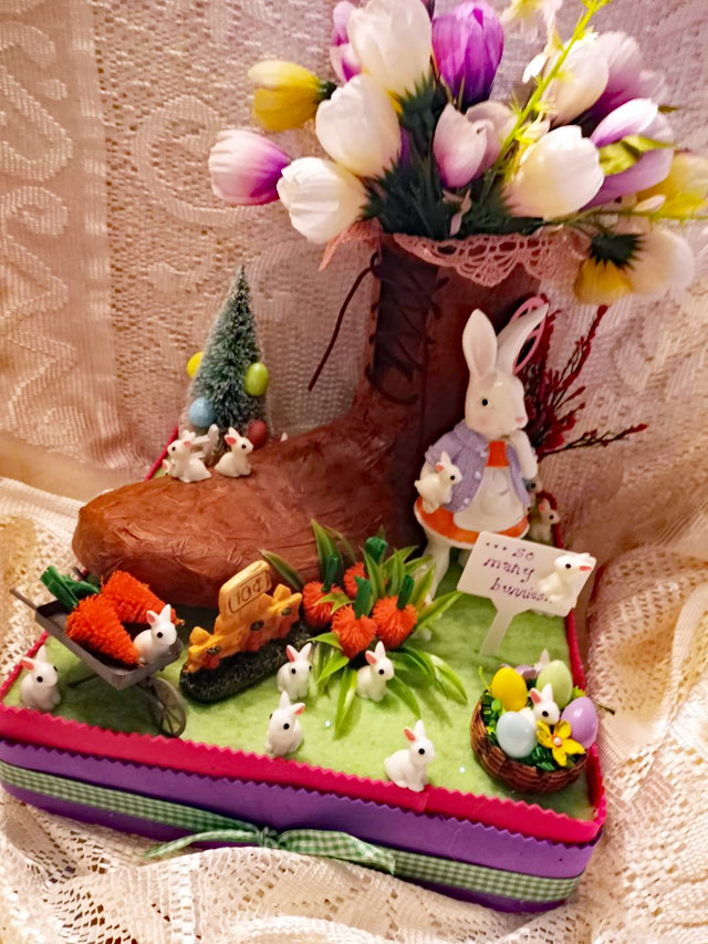 Miniature bunny house made out of paper mache shoe