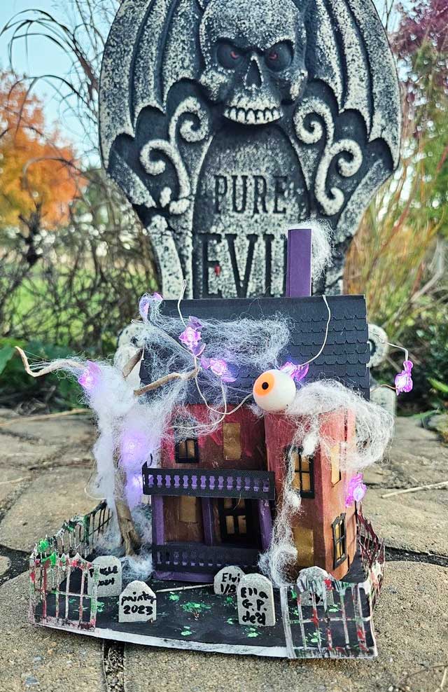 Vampire Villa in front of tombstone