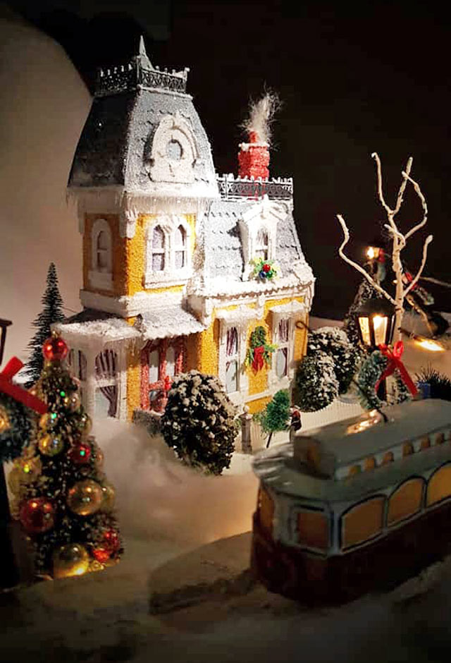 Miniature Yellow Victorian House decorated for Christmas 