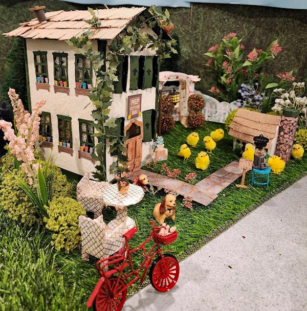 Gina's Peep Cottage Inn is such a cool little house, with a yard home to two spaniels and a bunch of little chicks! You can get feed for the chicks from the little machine on the sidewalk. 5 cents!