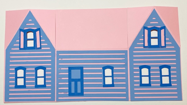 Adhere decorative pieces to body of house