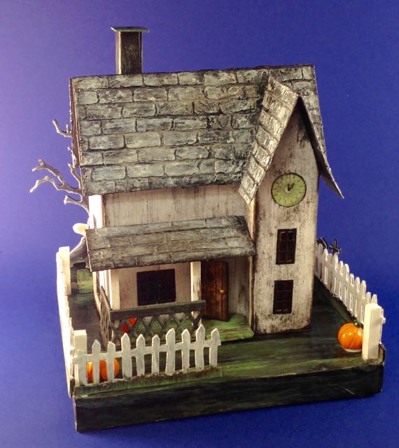 Jennifer's paper Halloween House with pumpkins in yard and spooky cardboard fence