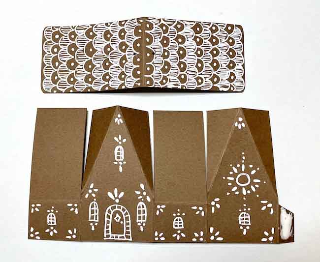Apply glue on glue tab of the paper house chalet ornament