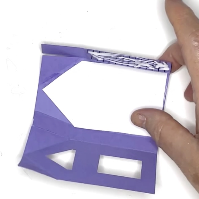 Apply glue to glue tab on Haunted House front extension
