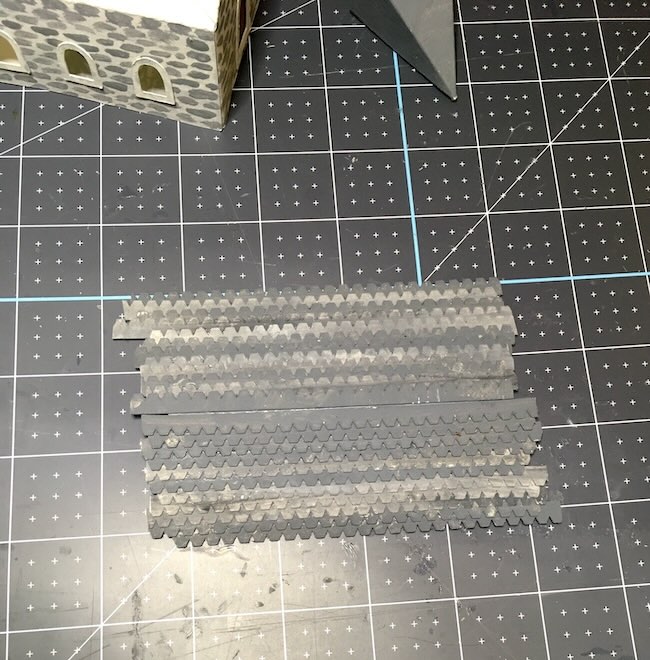 Apply glue to roof for shingles