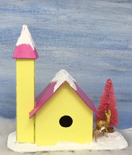 Back view Little Putz Church with side steeple showing the hole cut out for lighting deer hiding behind bottlebrush tree