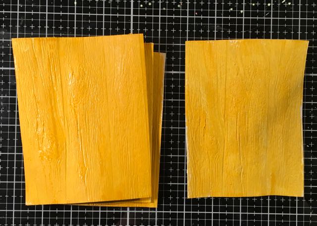Base color for embossed cardboard to mimic wood