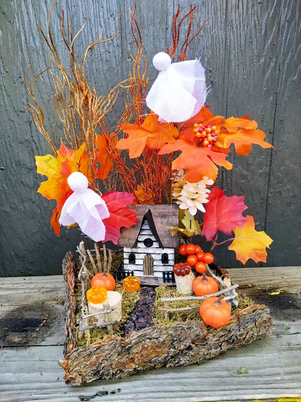 Miniature Halloween House with bright fall leaves