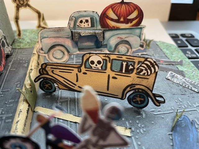 Cars in parking lot of  Dairy Scream Parlor