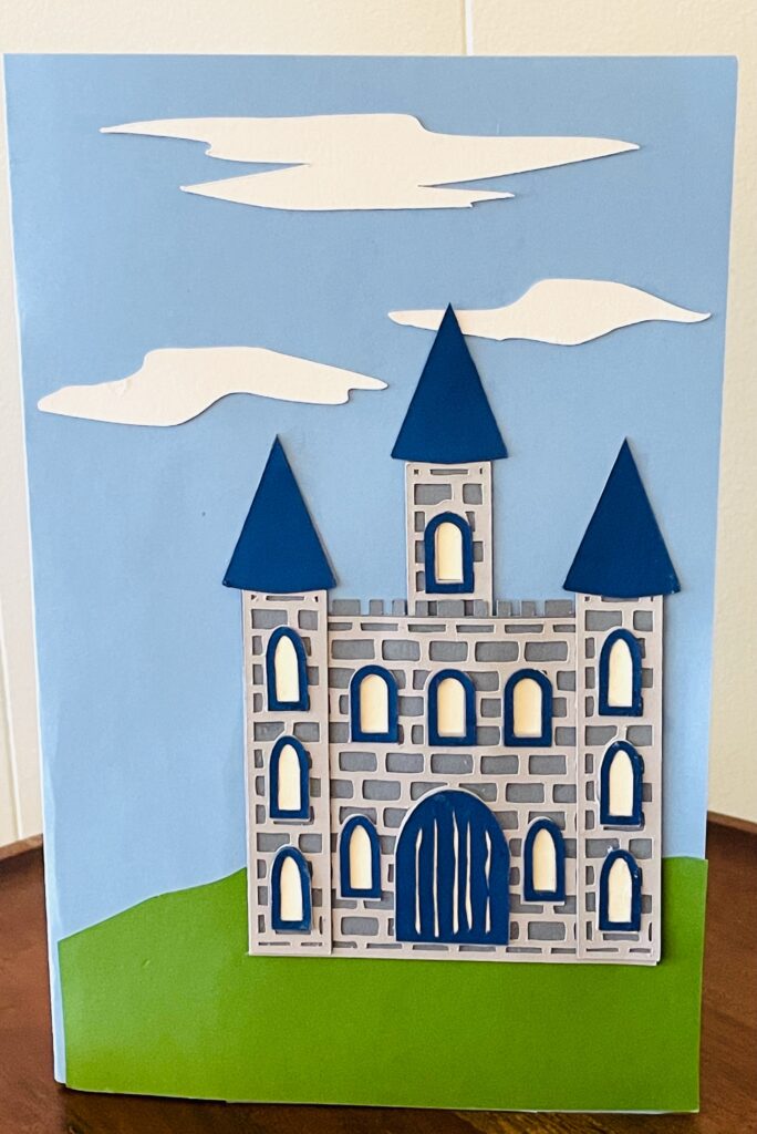 Grey castle on front of card