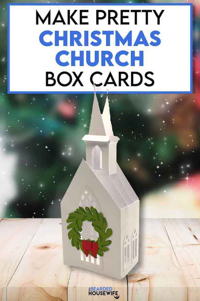 White paper Christmas church box card with green wreath on door