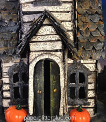 Halloween village dwelling Close-up of Village Manor miniature cardboard house