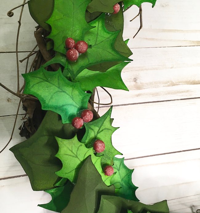 Close up of wreath paper leaves and berries