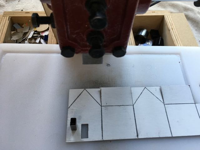 Cutting windows with an arbor press on the miniature house template
