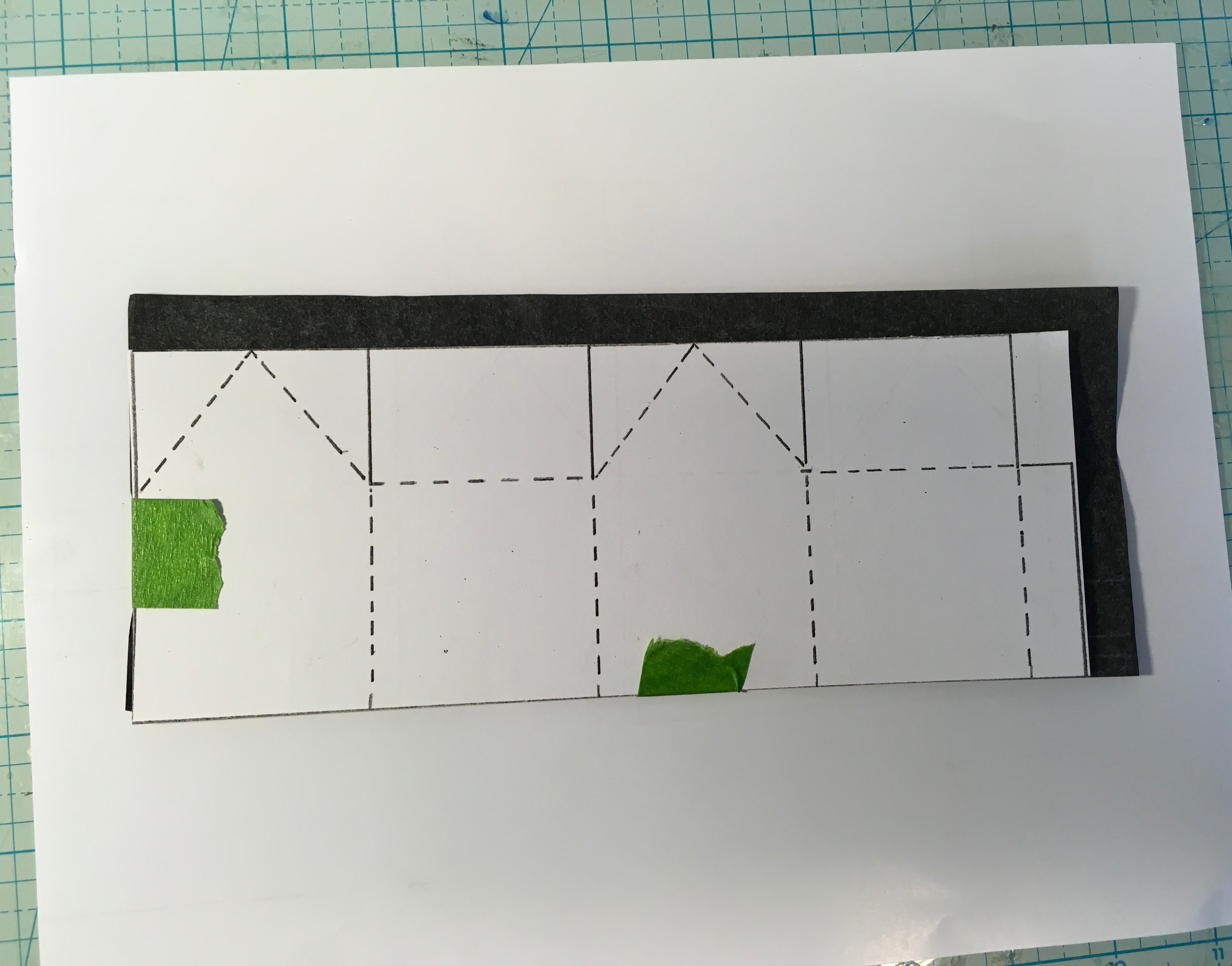 Transfer miniature house pattern to cardboard using carbon paper