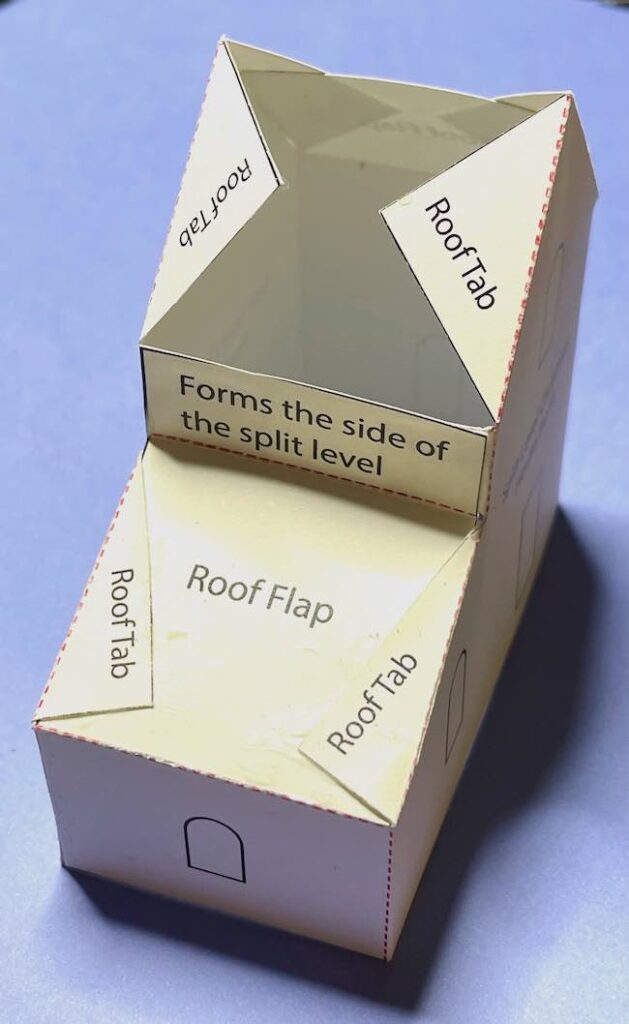 Fold the roof tabs over the side roof flap
