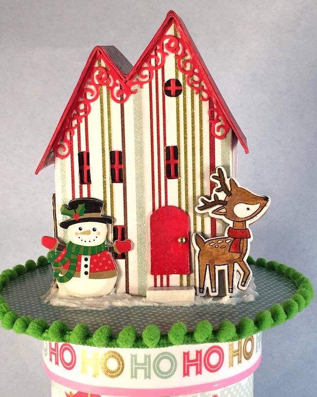 Front of little Christmas Putz house on ribbon roll