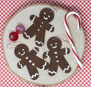 Gingerbread man ornaments made with gingerbread paint