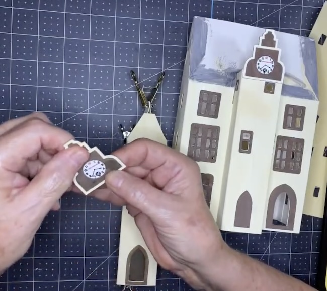 Glue clock behind the front tower trim