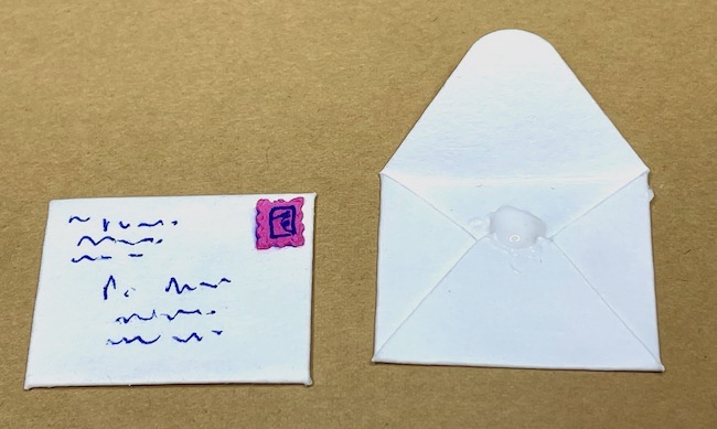 Glue down the envelope top flap