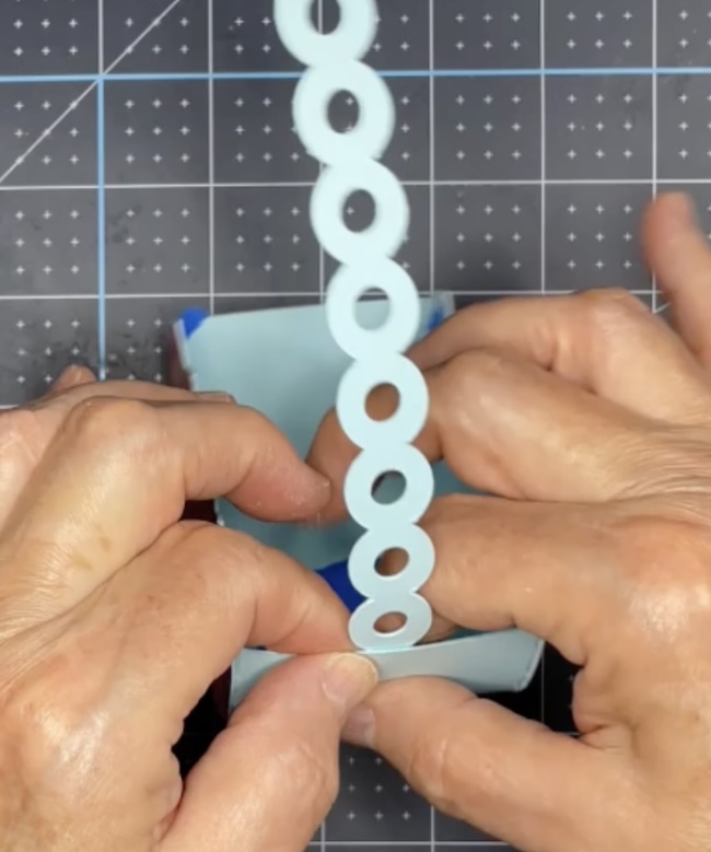 Glue handle to candy basket