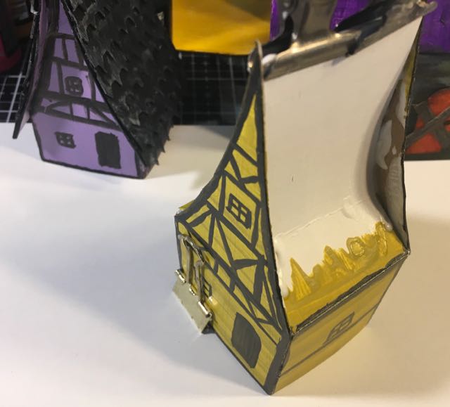 Glue roof tabs behind gables Medieval Haunted Paper house