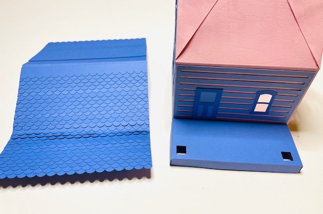 Glue shingles to roof piece before you adhere to roof