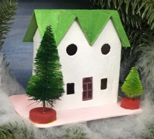 Green twin gable house in Christmas wreath