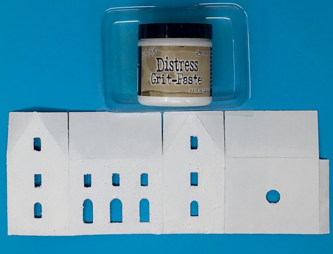 Grit paste applied to cardboard house pattern
