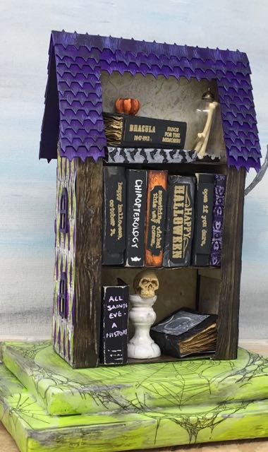 Books titles and specimen jars on the back of miniature Harlequin House Used Bookstore #putzhouse #halloweenhouse #papercraft