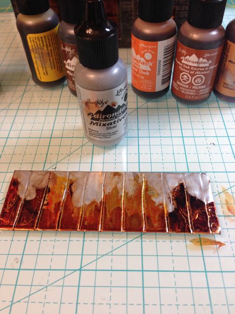 Alcohol ink fixative adds dull patina to rusted roof