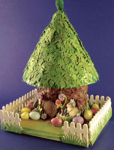 Easter house on a tree stump base #putzhouse #Easter #papercraft