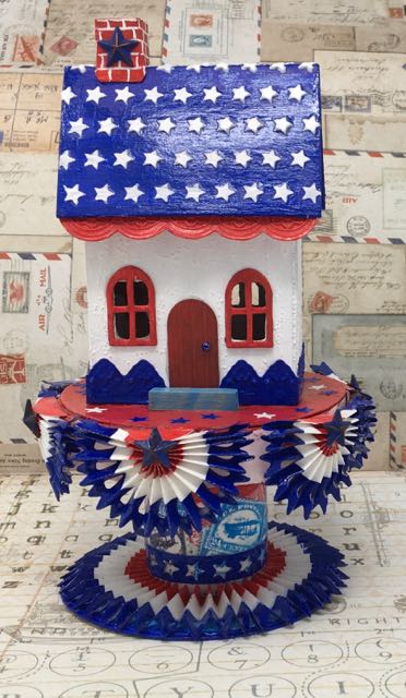 Starry Patriotic House - a paper house for the Fourth of July decorated in red, white and blue #putzhouse #fourthofjulyholidaydecor #holidaypaperhouse