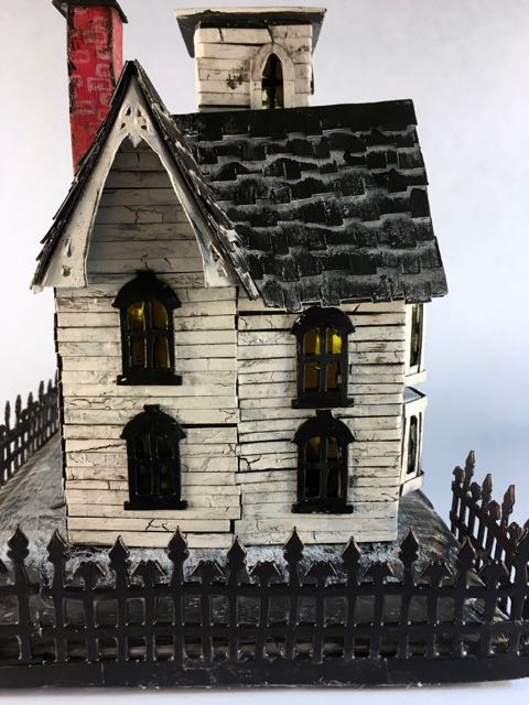 Halloween house with hand cut cardboard trim to mimic the Italianate trim #halloweenhouse # halloween #putzhouse #papercraft