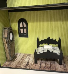 Larger bat wing bed in dollhouse