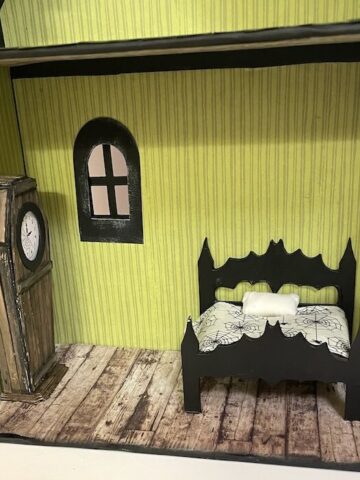 Larger bat wing bed in dollhouse