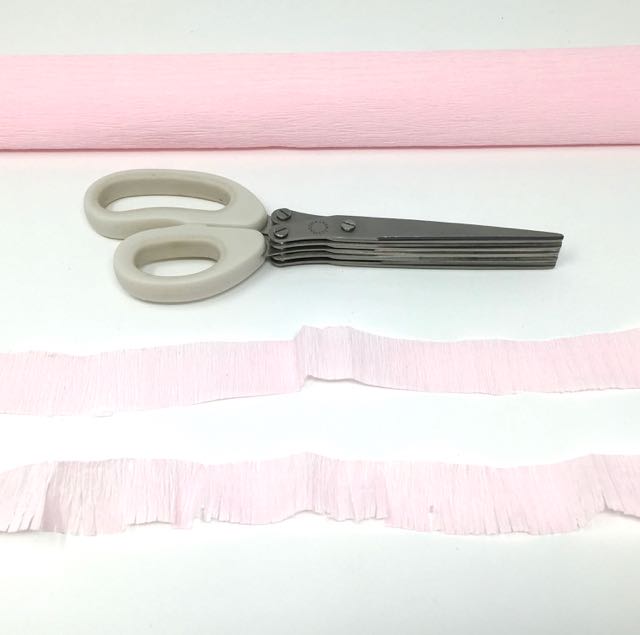 Materials to make the pinata candy box crepe paper fringe scissors