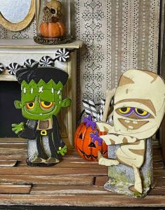 Monster and mummy paper figures inside halloween dollhouse