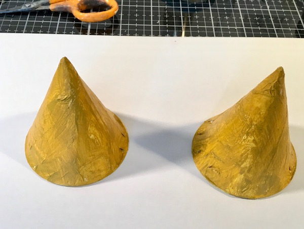 Painting the cones for the leafy top tree stump paper houses