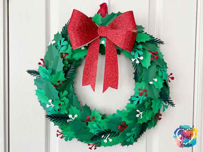 Green Holly Paper-Christmas-Wreath with red paper bow