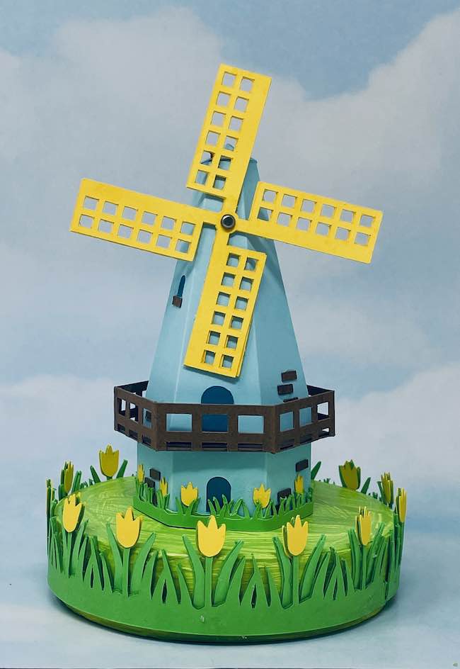 Blue and yellow paper dutch windmill on tulip base