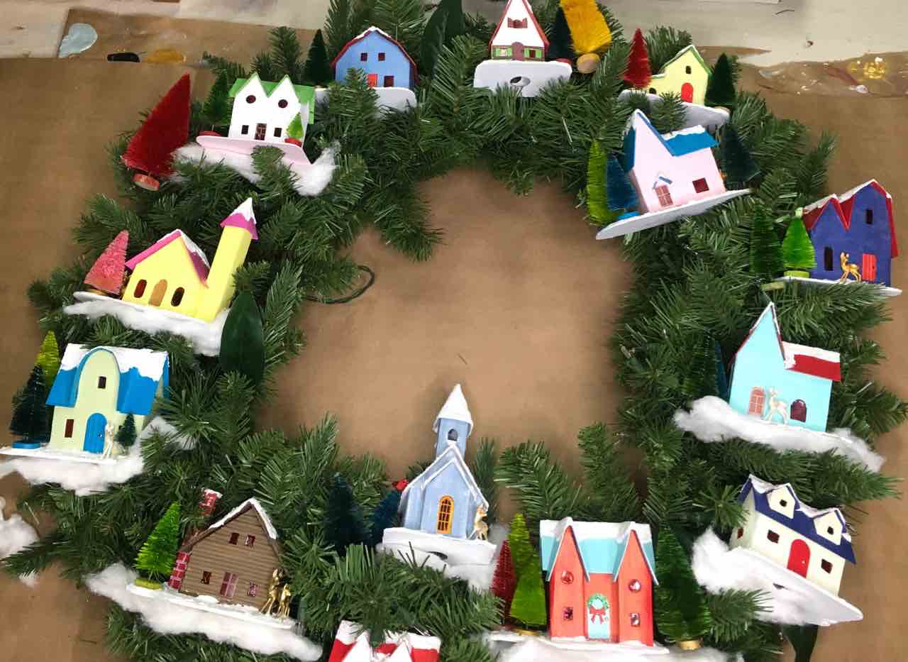 Place the putz houses where you would like them to be on your snow village wreath