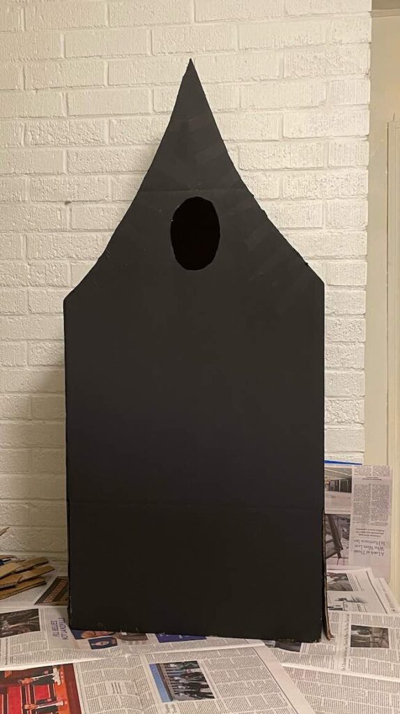 Black painted house costume from cardboard box