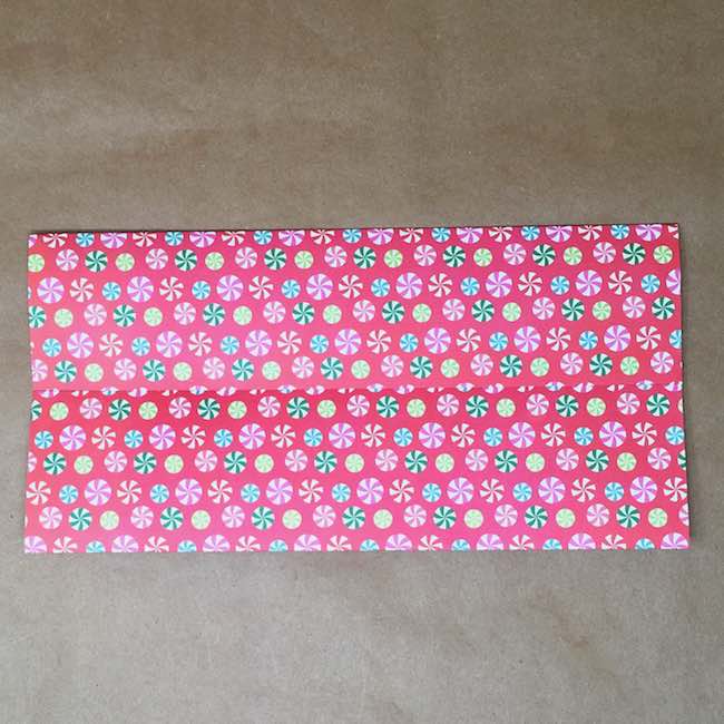 Scrapbook paper with both halves folded to middle