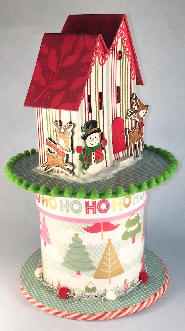 Side view of Christmas Putz house on ribbon rool