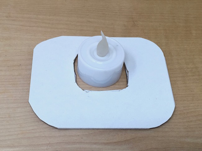 Simple cardboard base with LED votive tea light
