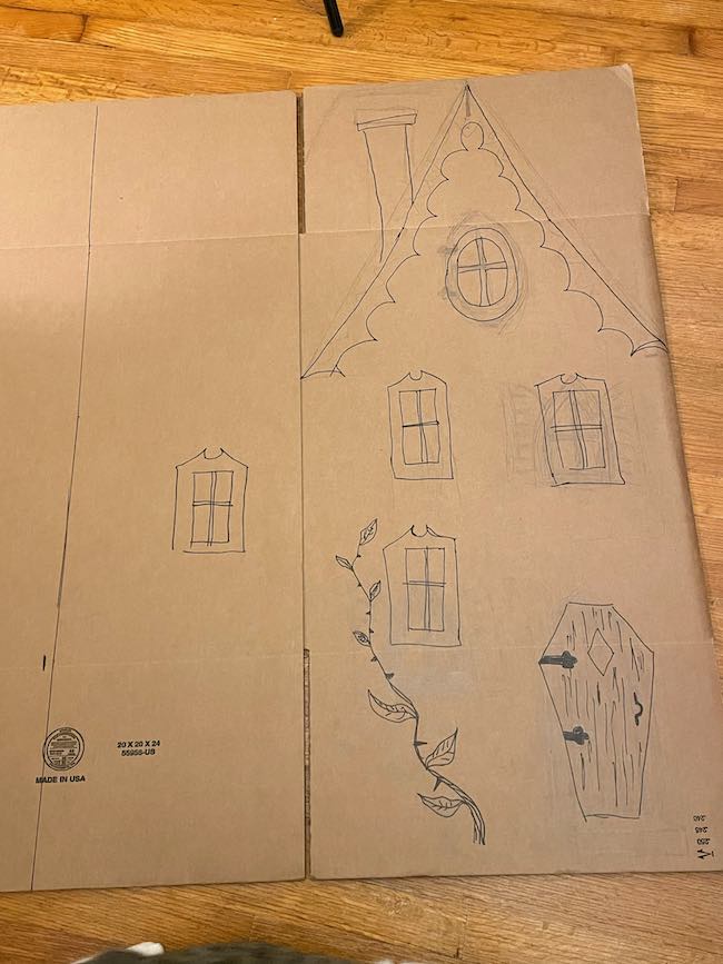 Sketched house on cardboard box