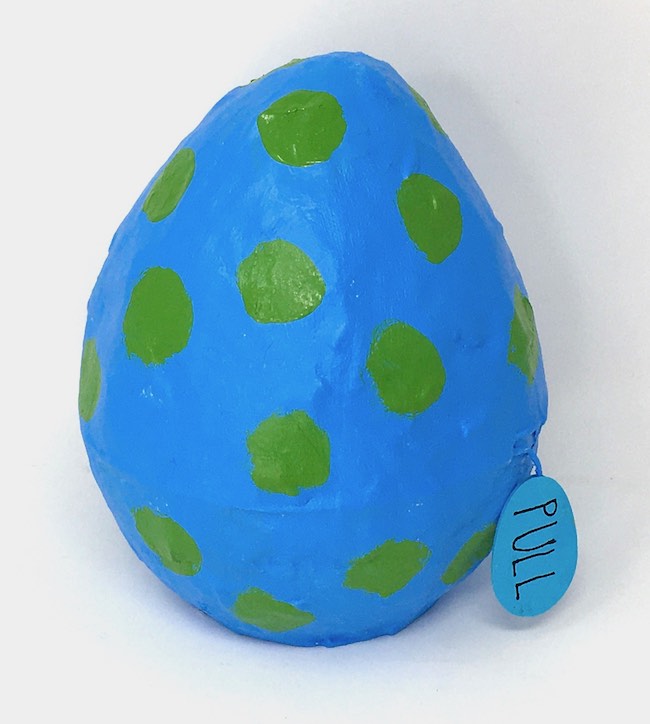 Spotted paper mache egg with pull tag